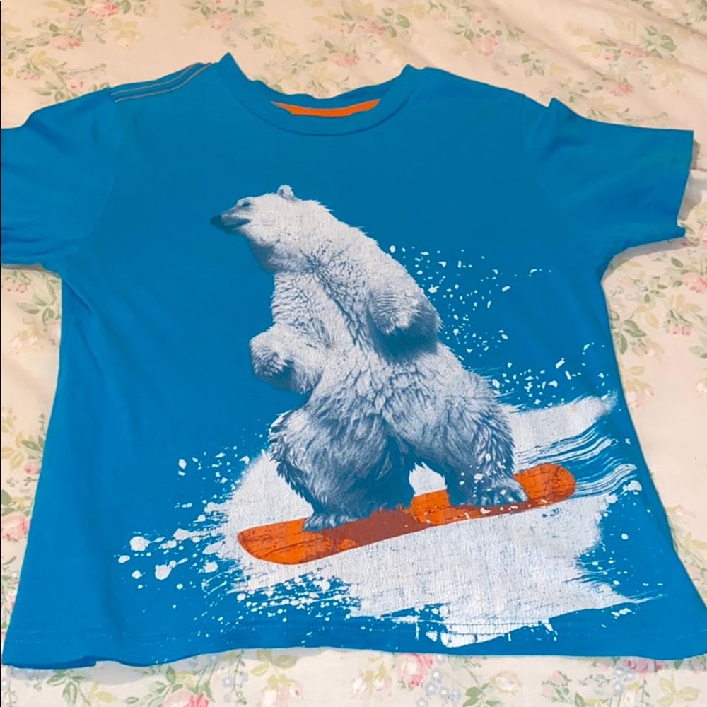 Selling two shirts with animal pictures on them.